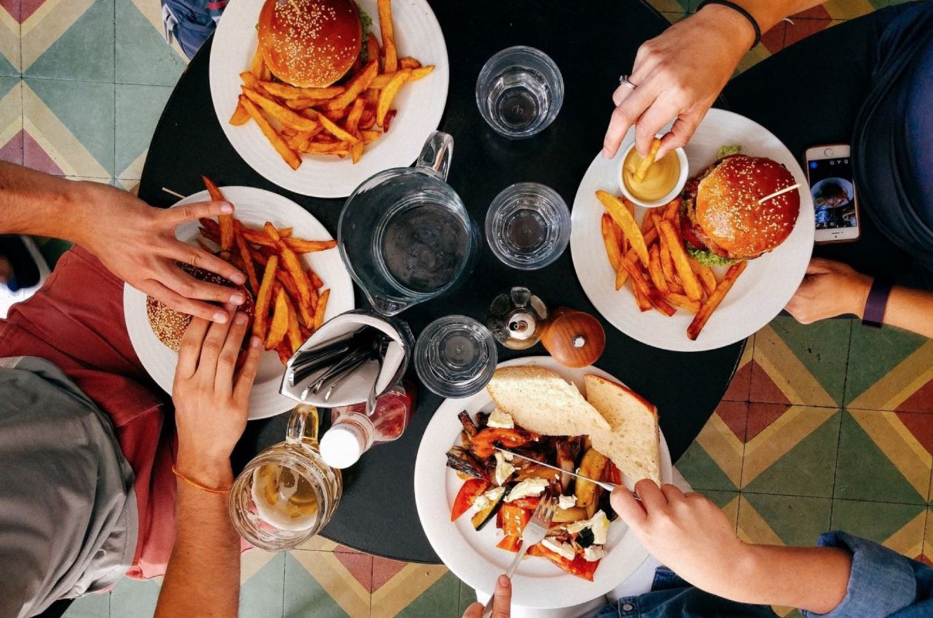 Urban appetites shape routines, streets, and friendships through quick plates and shared air