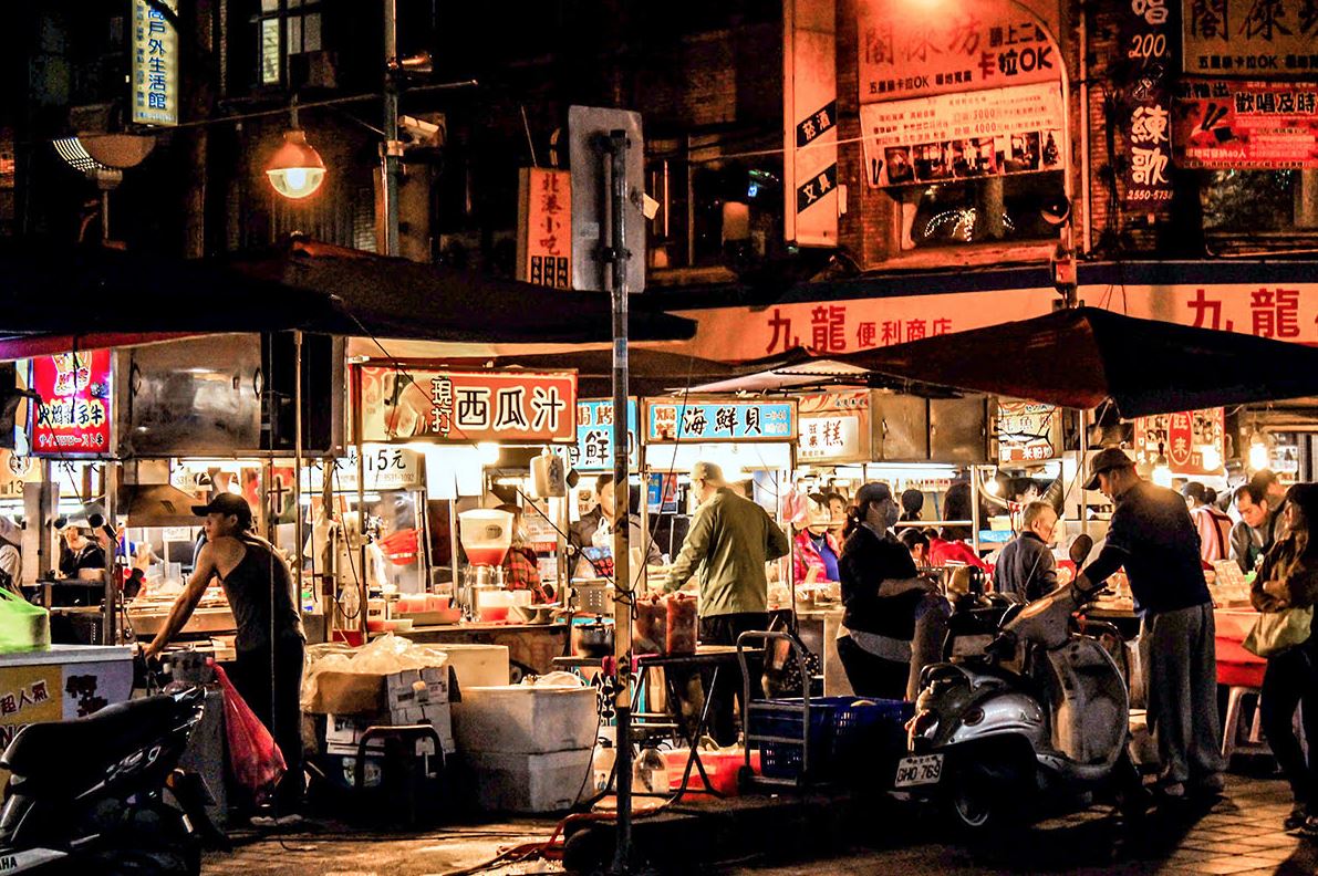 Evening bazaars turn sidewalks into kitchens and strangers into guides